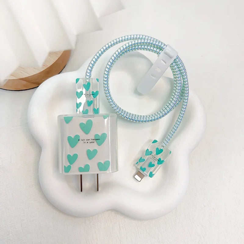 Phone charger set with heart pattern on a white background